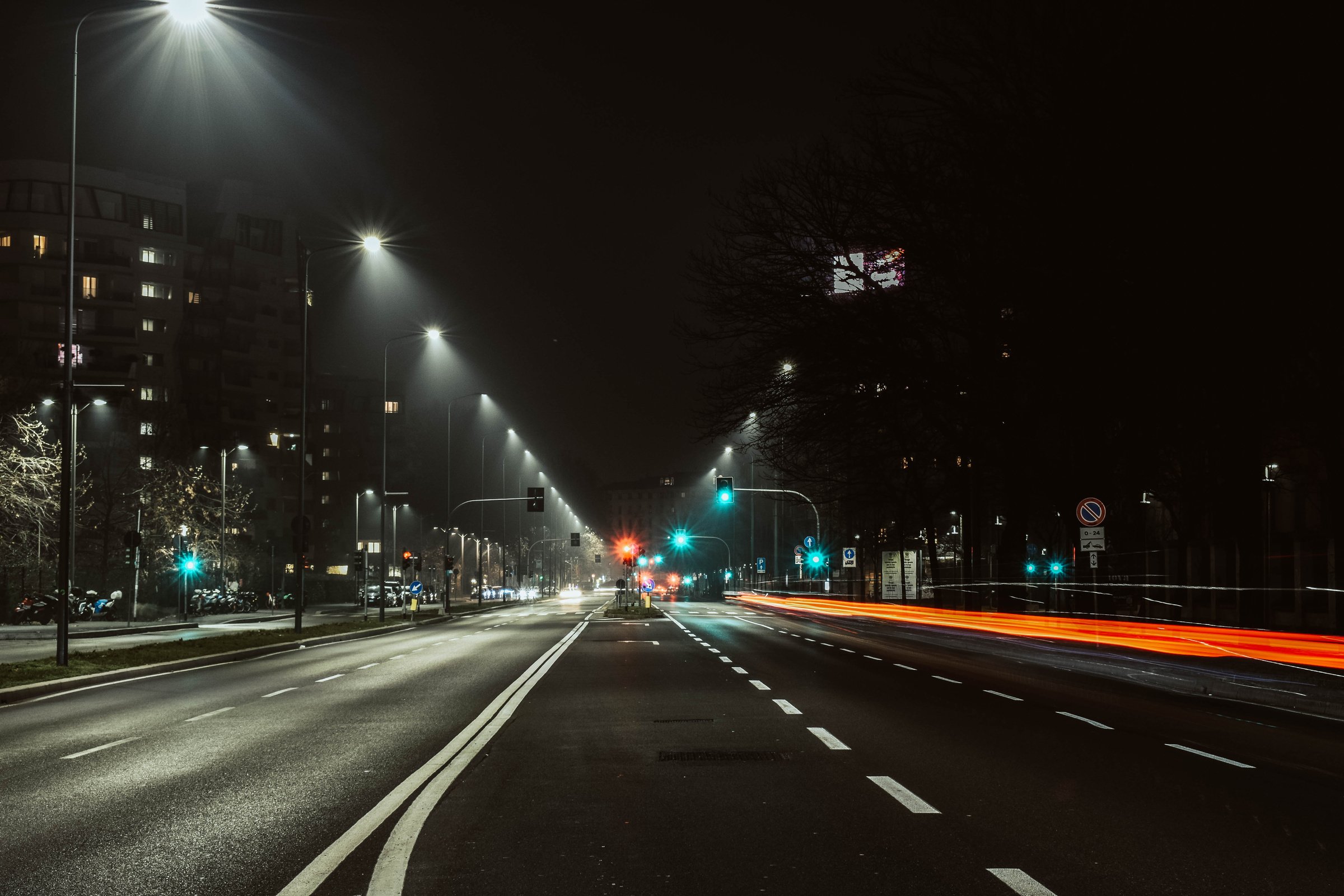 Asphalt Road with Street Lights During Night Time